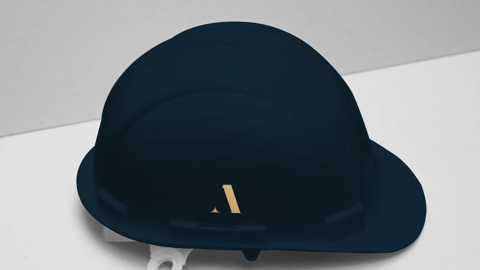 Navy construction helmet with gold monogram