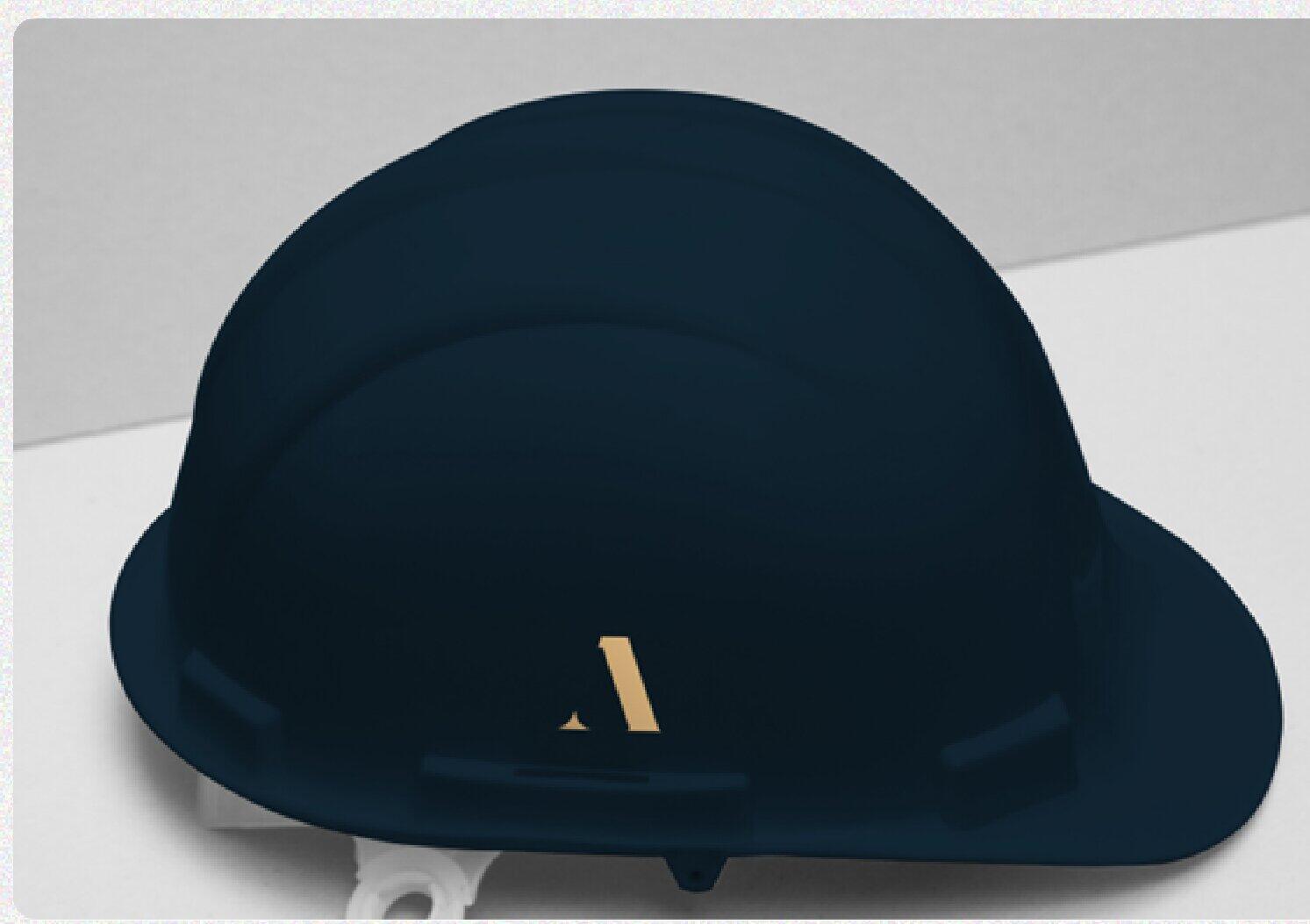 Navy construction helmet with the gold AHC monogram