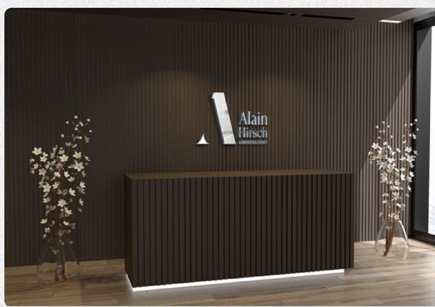 AHC logo on a wooden reception wall